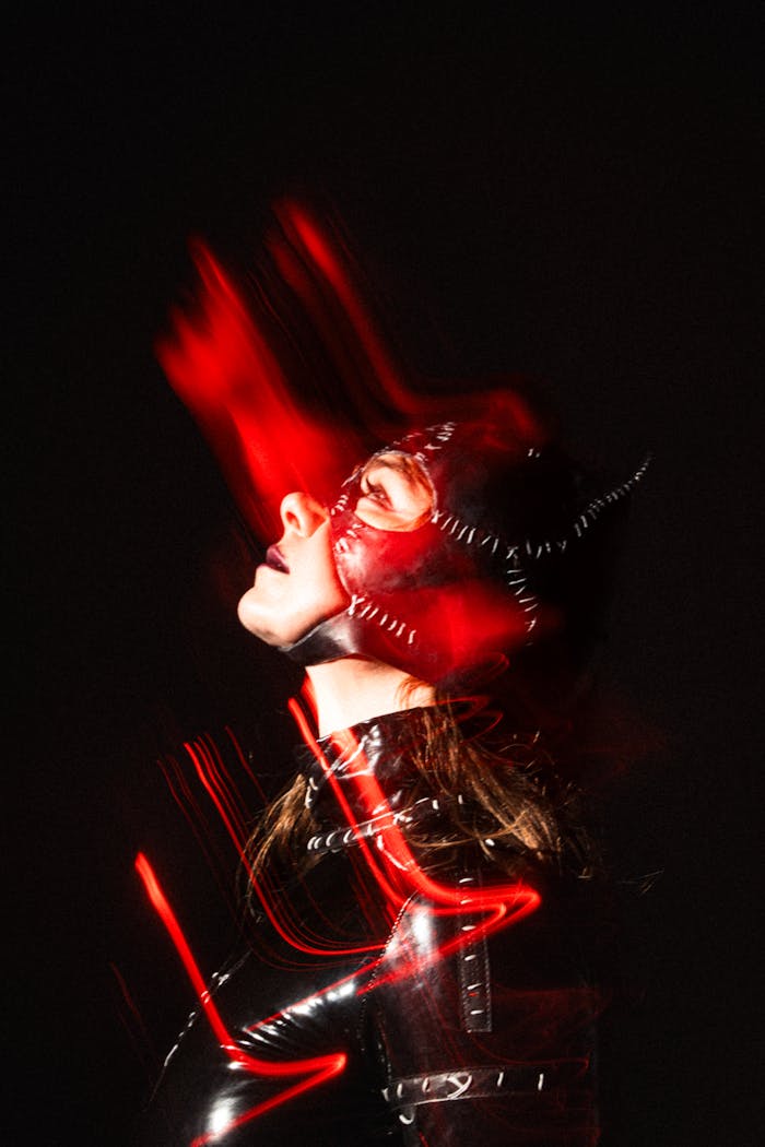 menu-06 Creative abstract portrait of a woman in Catwoman costume with striking motion blur effects.